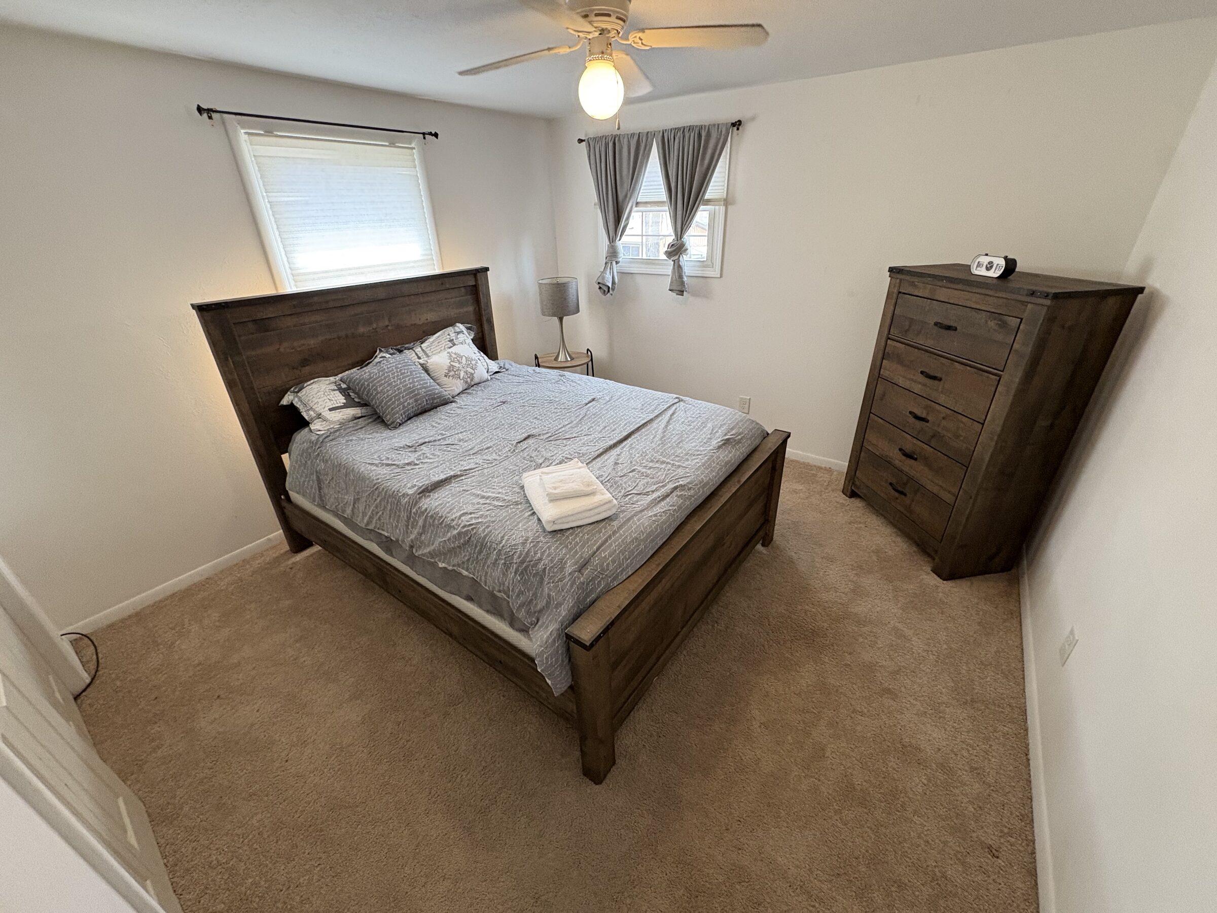 Rustic wood queen bedroom with natural light