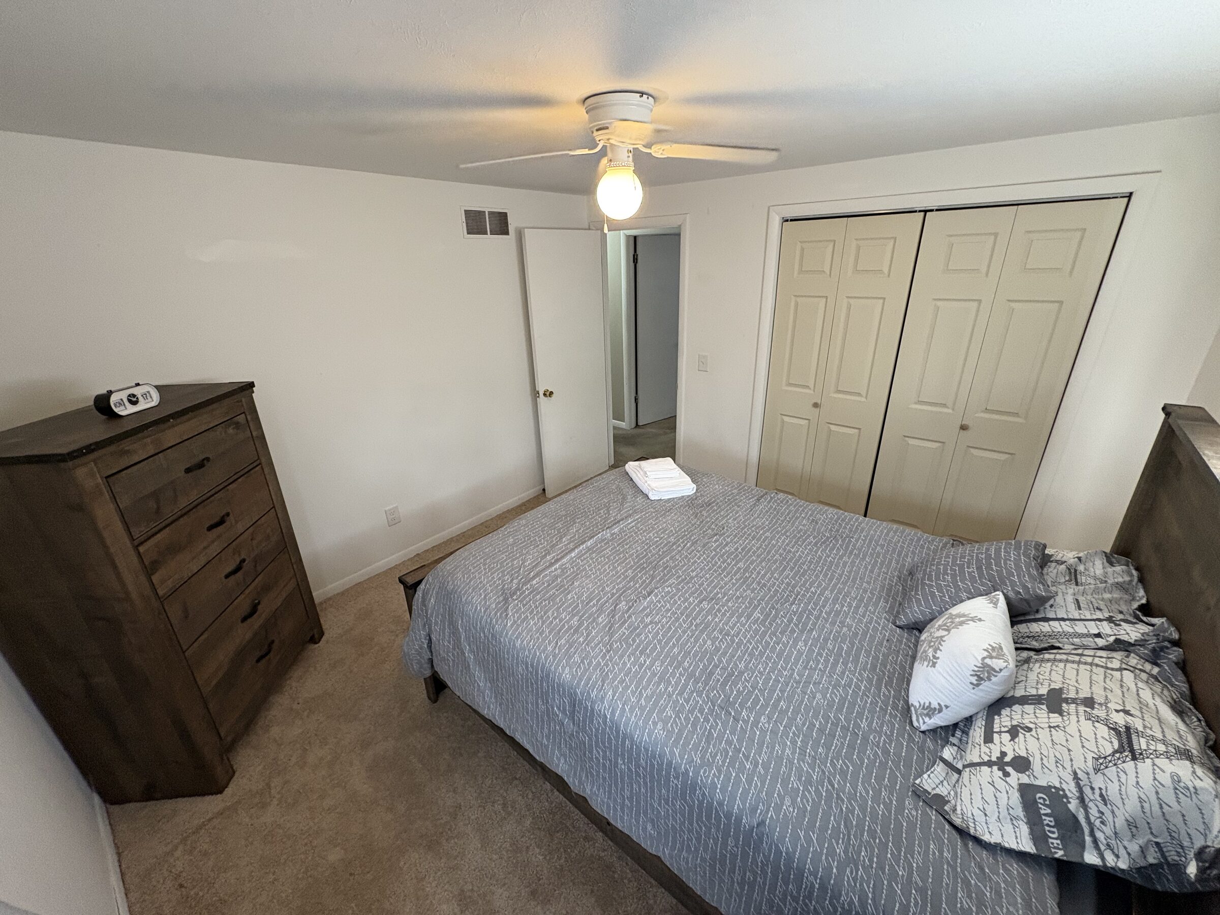 Fourth bedroom with Parisian-print bedding