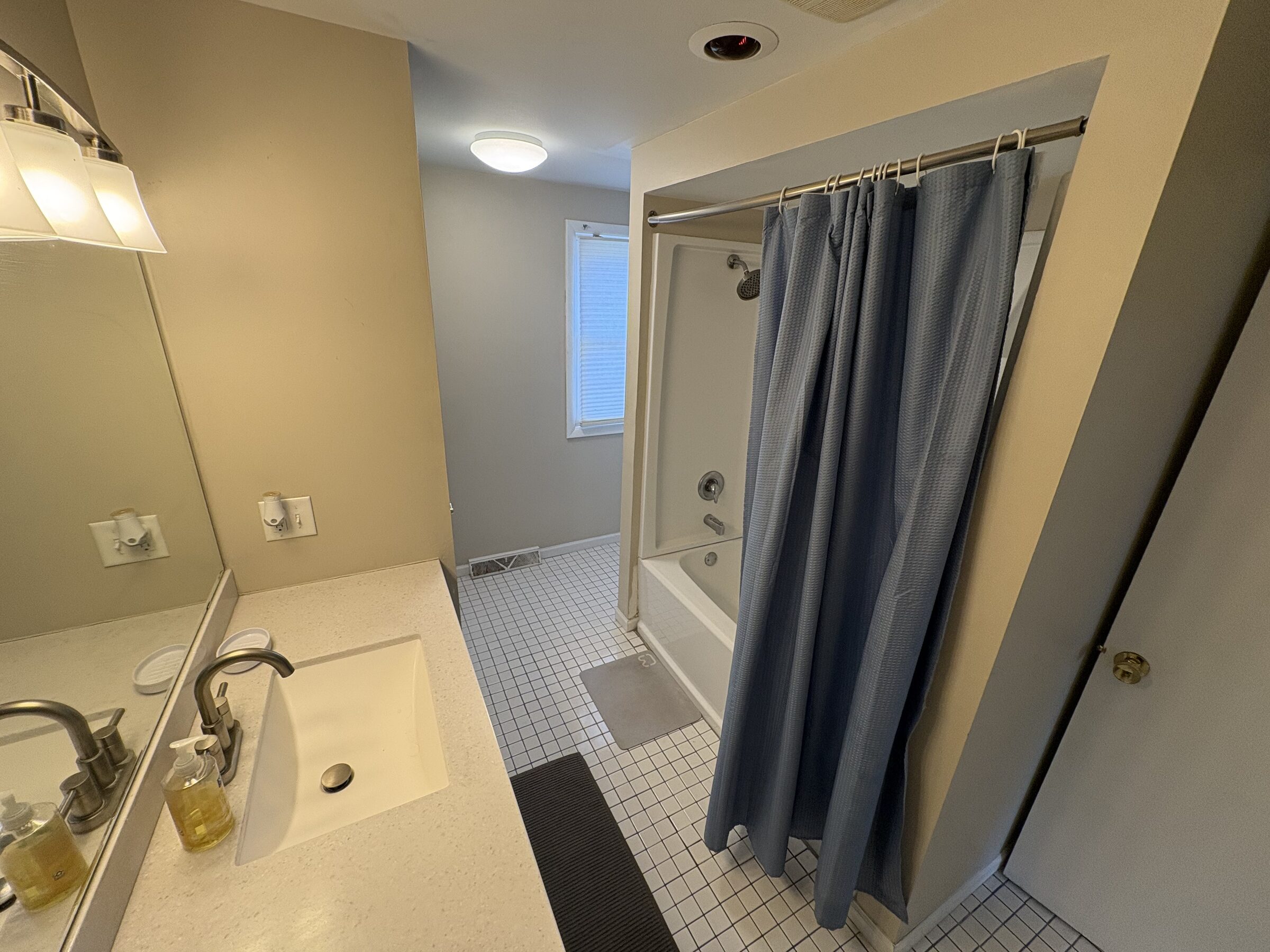 Full bathroom with tub, shower and tile floor